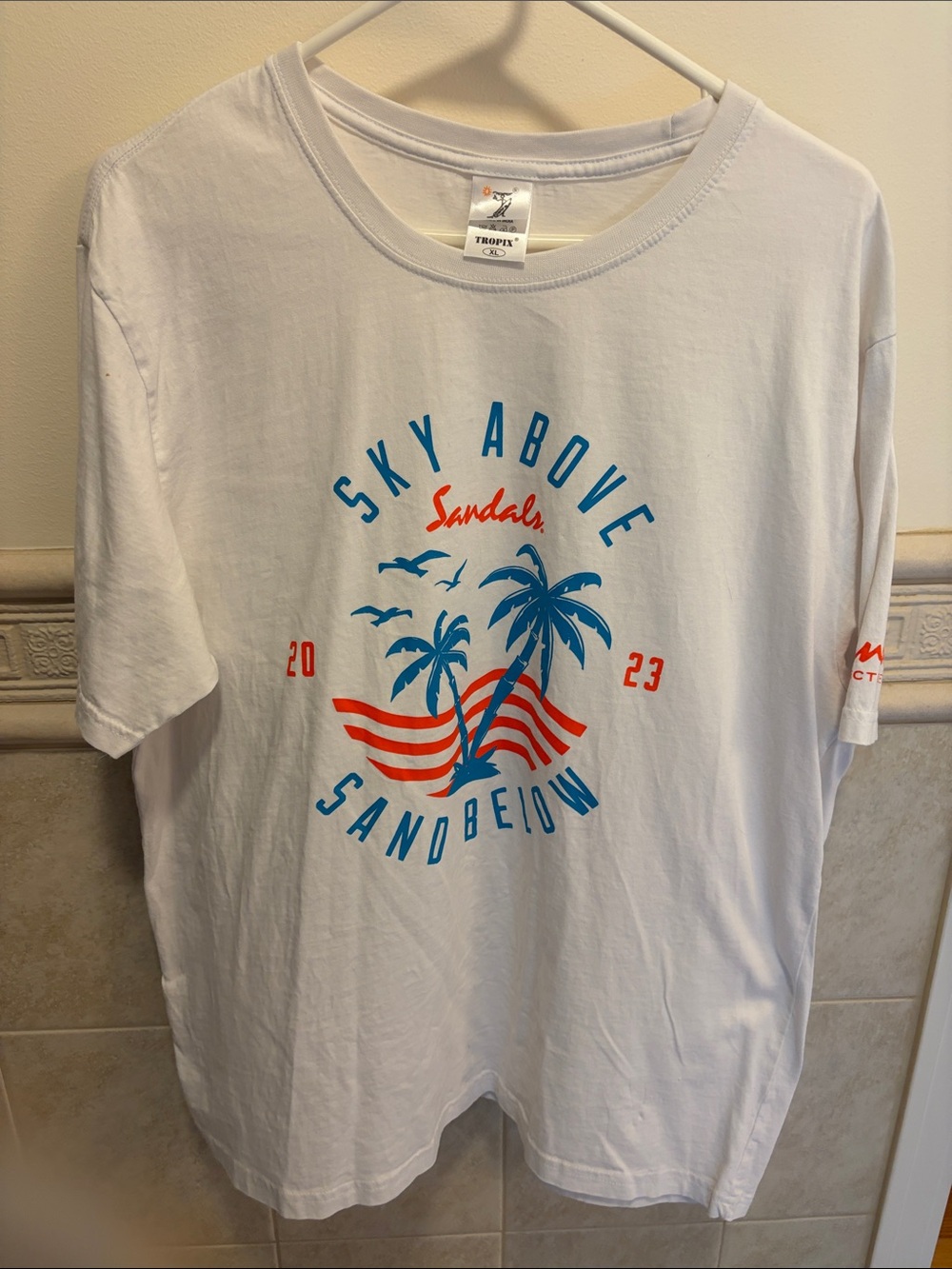 Sandals Resorts Sky Above Sand Below Graphic Tee - White/Blue/Red